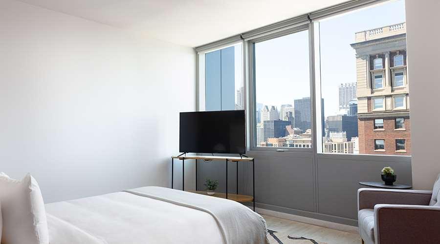 Sentral Michigan Avenue Aparthotel Chicago Kamer foto A bedroom at 100 East 14th Street